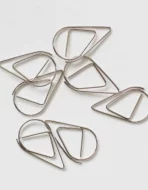 Black teardrop decorative paperclips on modern minimalist invitation